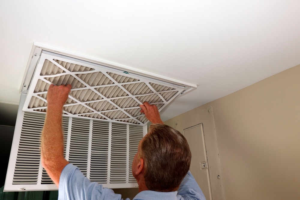 Dirty,Air,Filter,Being,Removed,From,A,Home,Furnace,Air