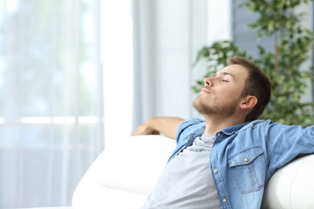 Man resting on couch